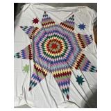 Star quilt top large on sheet