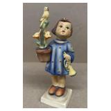 Hummel girl holding flower pot
