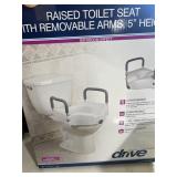 Raised toilet seat with removable arms 5 inches