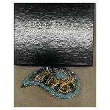 Joan Rivers turquoise, gold colored stone brooch