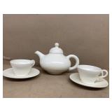 Teapot tea, cups, and saucers