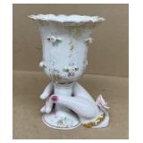 Decorative vase with hand holding