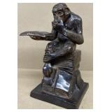Bronze monkey reading 10"