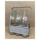 Aluminum Pepsi-Cola bottle carrier with bottles