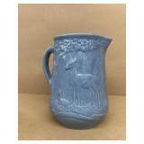 Blue stoneware water pitcher with deer