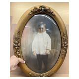 Oval framed photo of boy
