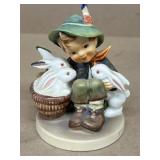 Hummel boy with rabbits