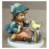 Hummel boy talking to bird