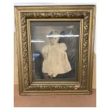 Little girl, gold frame picture