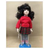 Porcelain doll with stand