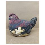The toy Works plush hen on nest