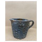 Blue pottery pitcher