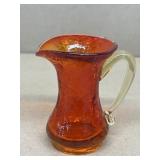 Orange crack on glass pitcher