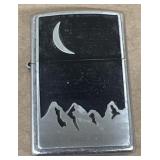Zippo moon over mountains, lighter