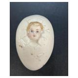 Antique egg with baby