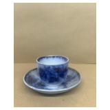 Antique flow blue tea cup and saucer leaf pattern