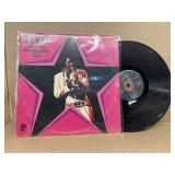 Elvis Presley sings hits from his movies record