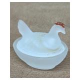 Miniature hen on a nest