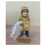 Wooden carved fisherman