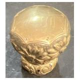 Walking cane top looks to be gold?