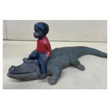 Cast-iron boy on alligator