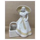 Pottery girl with basket planter