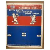 Putty knives, scrapers advertising board