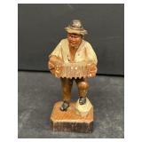 Folk cart, wood carved musician