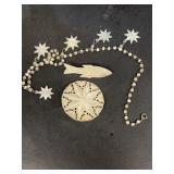 Fish, Bethlehem necklace, and star brooch