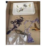 Purple stone necklace, wood carved duck and