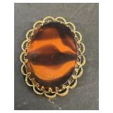 Amber and dark brown stone broach