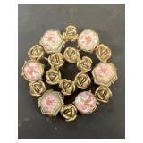 Antique brooch with pink flowers design