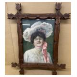 Antique walnut picture frame with print of lady