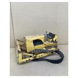 Bulldozer missing front wheel and back wheel