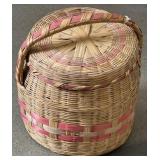 Large red and tan weave basket