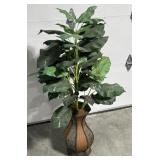 Decorative vase with artificial leaves