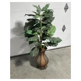 Decorative vase with artificial leaves