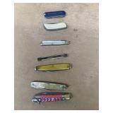Group of pocket knives as is