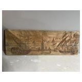 Hand carved ships on wood
