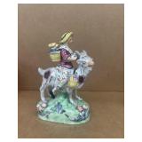 Pottery woman riding goat