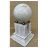Large marble on stand