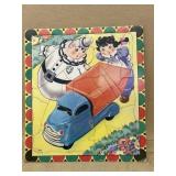 Roly-poly doll and truck puzzle