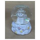 Dream, sickle, water globe