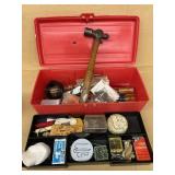 Tacklebox with fish hooks and tools