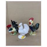 Chicken figurines, some have chips