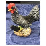 Chicken with baby chick statue