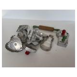 Cookie cutters and rolling pin with green paint