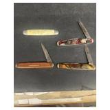Group of four pocket knives