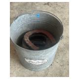 Galvanized bucket with horseshoes