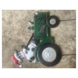 Cow sitting on a tractor metal yard sign